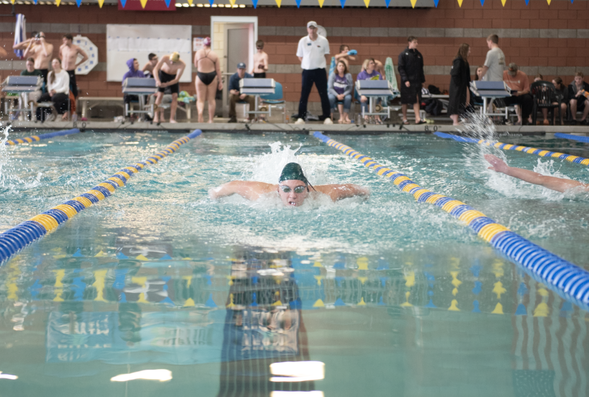 1.31.25 Junior Sarah Spini swimming 100 butterfly at Butte. 